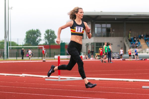 Woman running on an athletics track