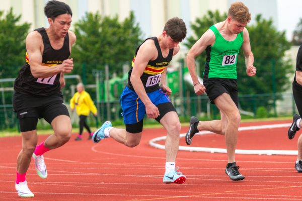 Men running on an athletic track