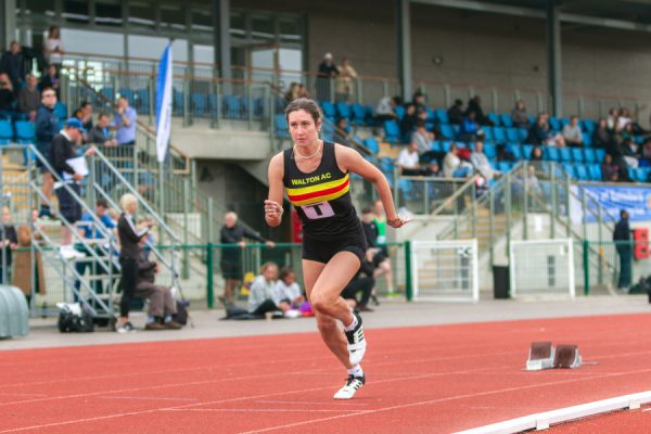 Woman running on an athletic track