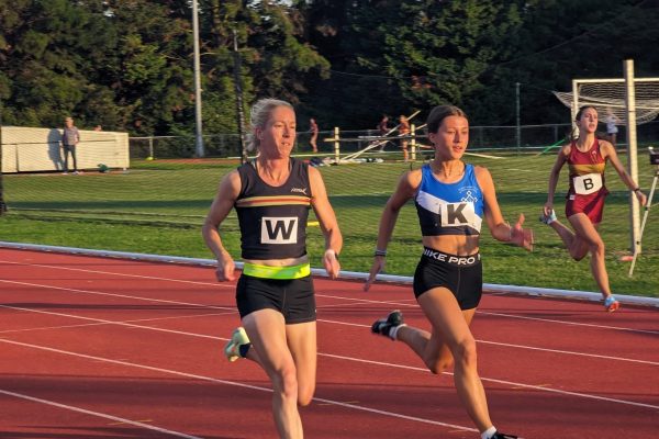 Ladies running on an athletes track