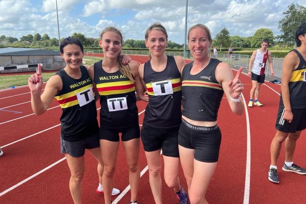 Group of ladies in Walton vest on an athletics track