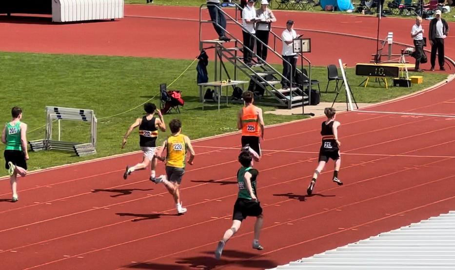 Men running on an athletics track