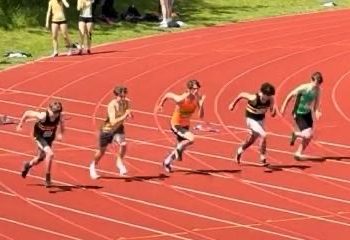 Men starting a race on an athletics track