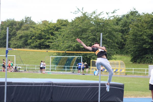 Boy jumping over the high jump