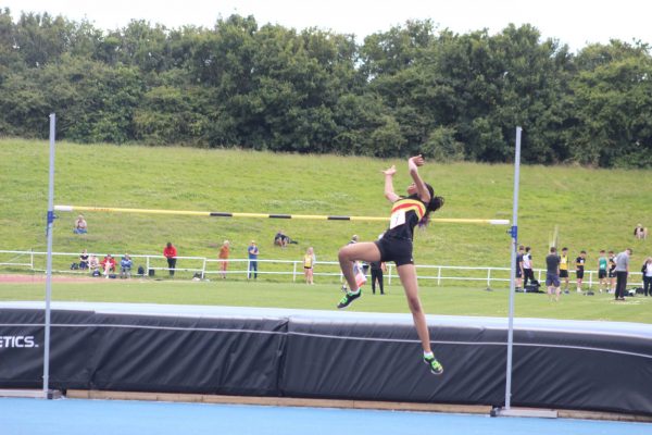 Lady jumping over the high jump